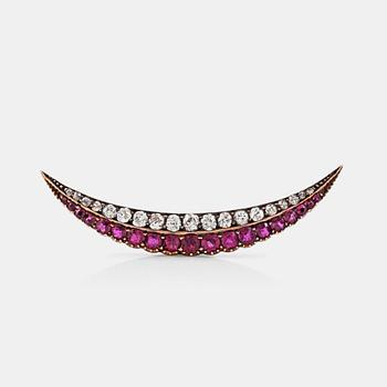 1283. A circa 1.10 ct old-cut diamond and ruby brooch.