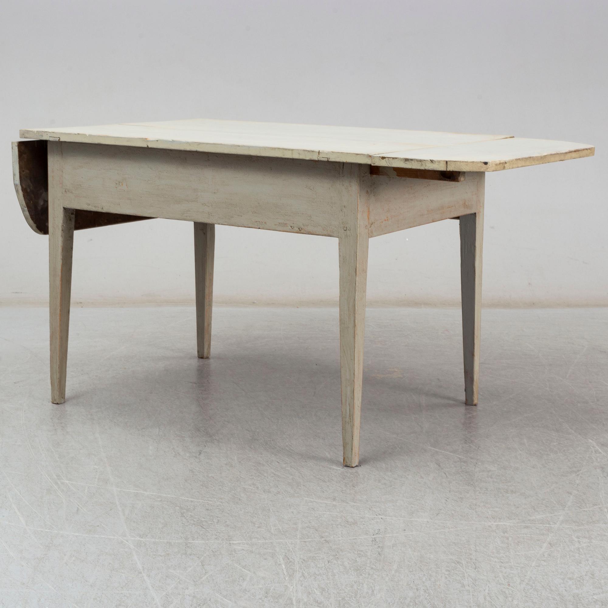 An early 19t Century folding table.