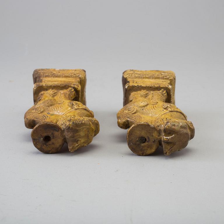 A pair of yellow glazed chinese joss sticks holders, 17th Century.