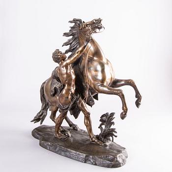 Guilliaume Coustou, after, a signed bronze sculpture  "Chevaux de Marly" from the second part of the 1800's.