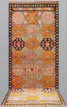 A kurdish kilim, ca 430 x 155 cm.