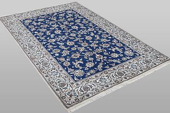 A carpet, Nain, part silk, ca 297 x 194 cm.