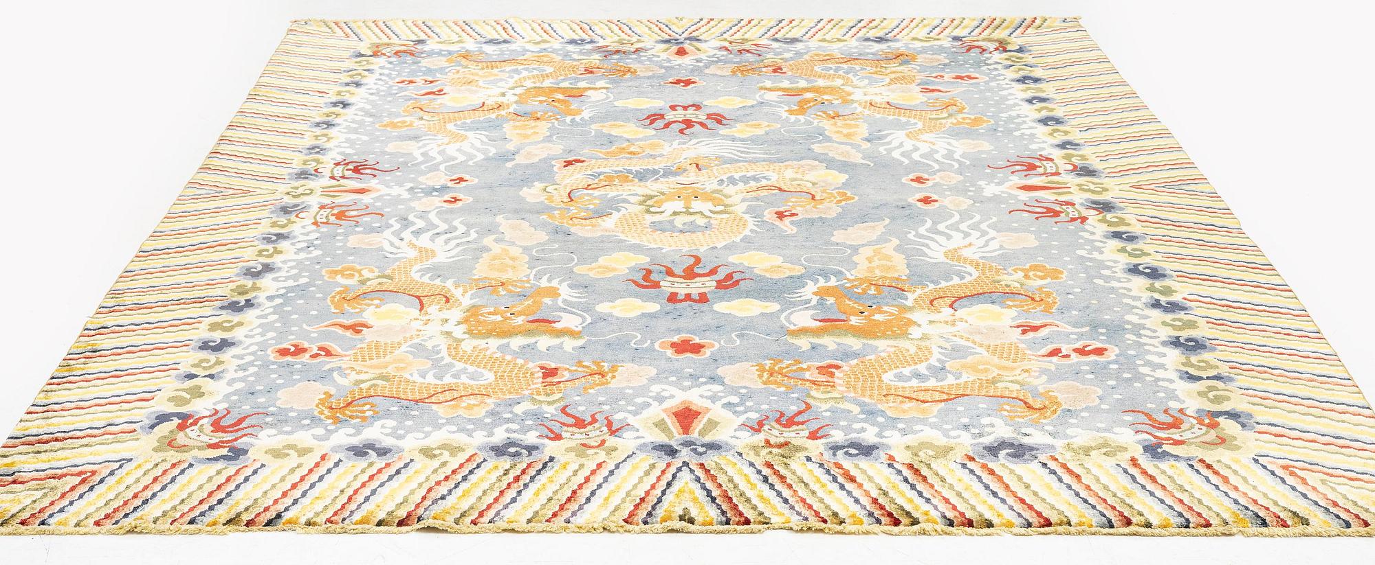 A semi-antique chinese ' Five dragon' silk carpet, c 335 x 254 cm.