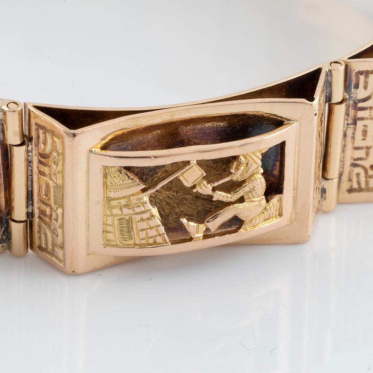 Gold panel bracelet.