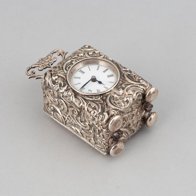 A rococo-style silver clock, mark of Henry Matthews, Chester 1903.