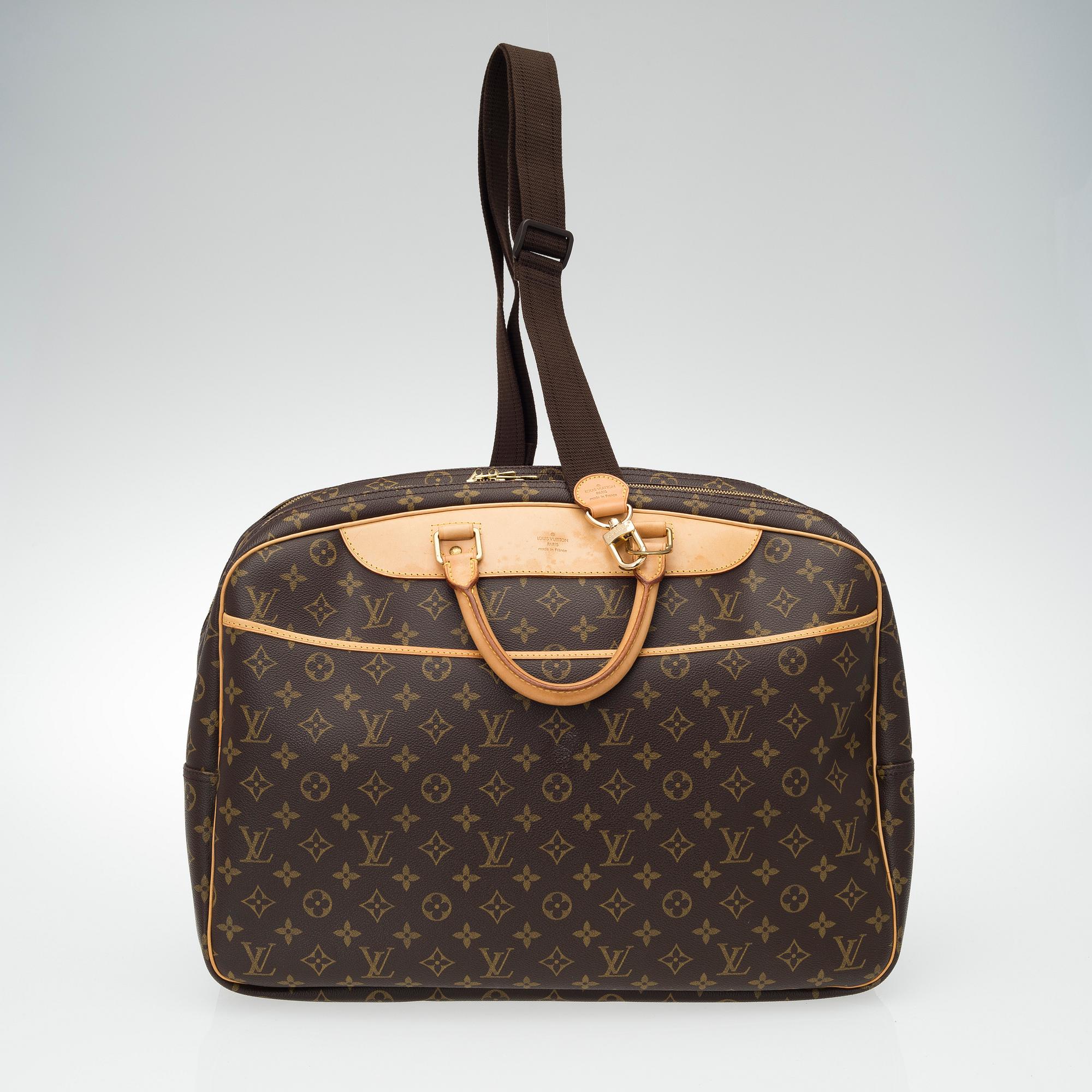 A Louis Vuitton, "Alize 24 Heures" Monogram Canvas Travel Bag.