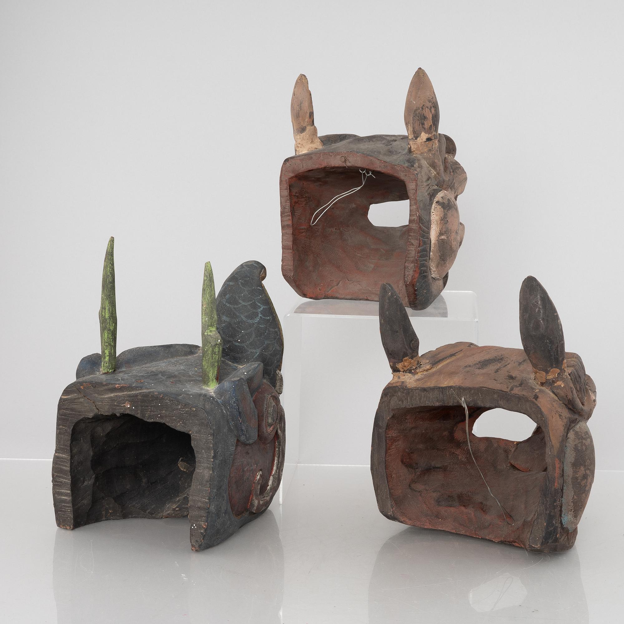 Four Tibetan/South East Asian wooden decorations, 20th century.