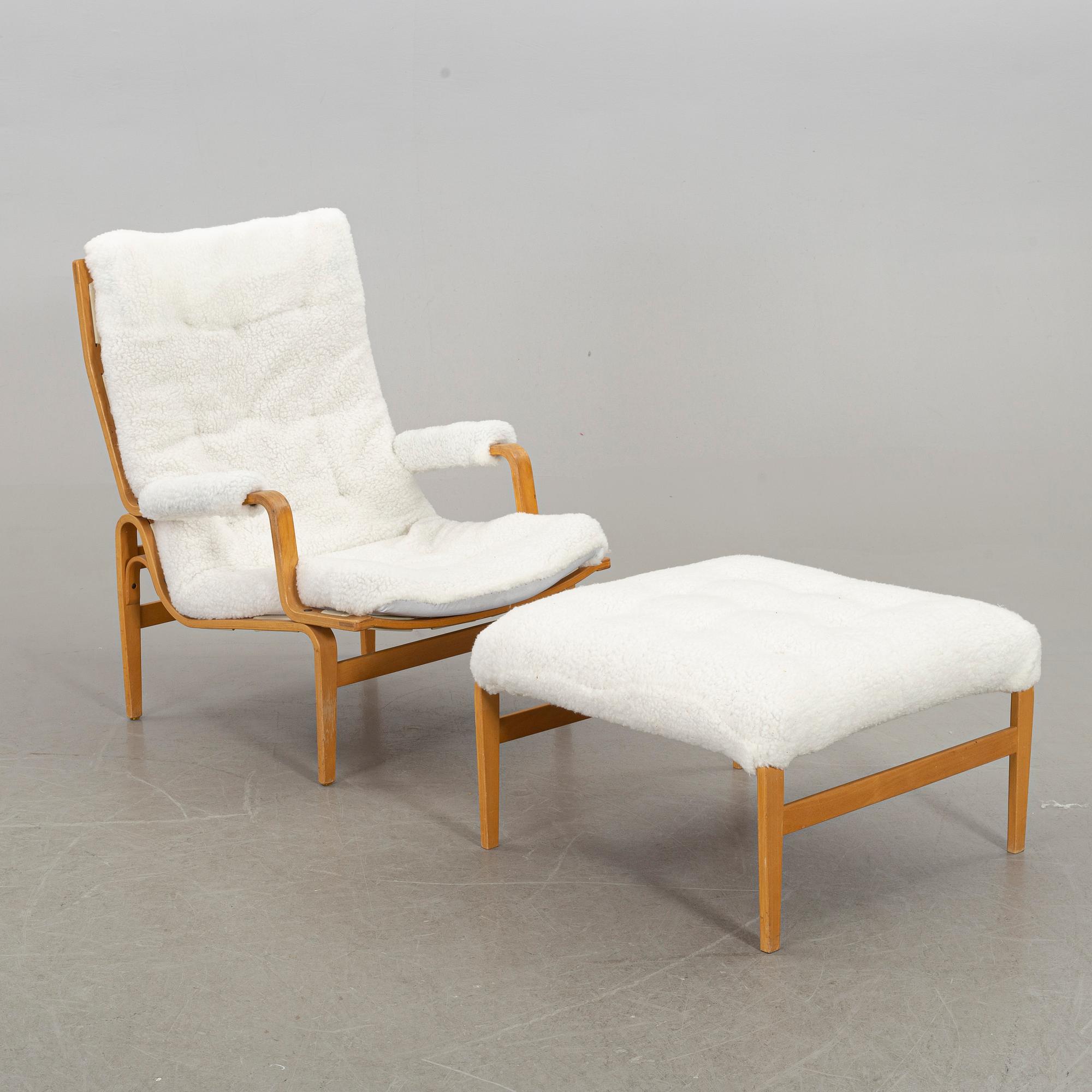 BRUNO MATHSSON, an "ingrid" armchair and stool for Dux. Late 20th century.