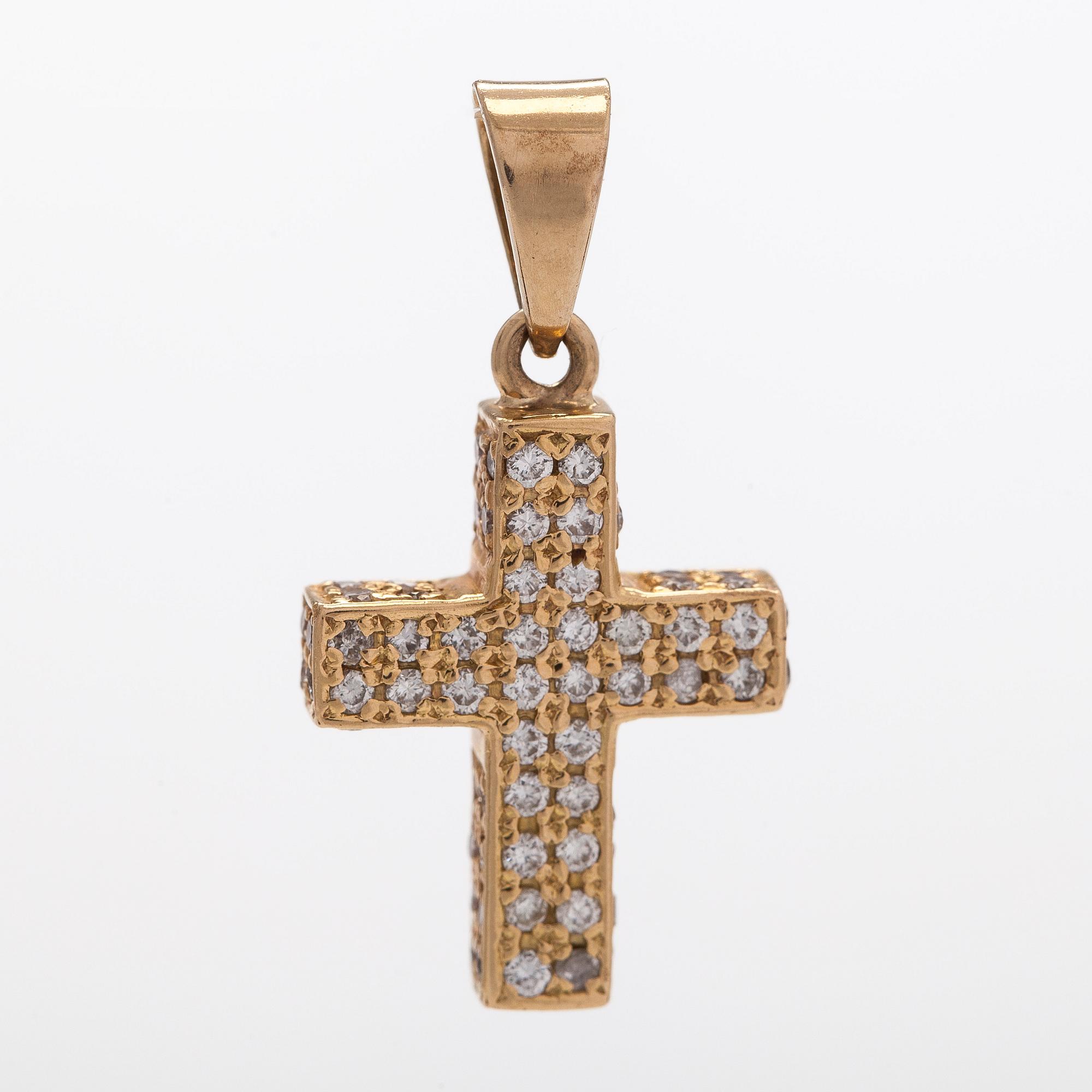A 14K gold cross pendant with diamonds.