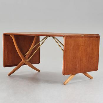 Hans J. Wegner, a teak, beech and brass dining table, model "AT-314", for Andreas Tuck, Denmark 1950-60's.