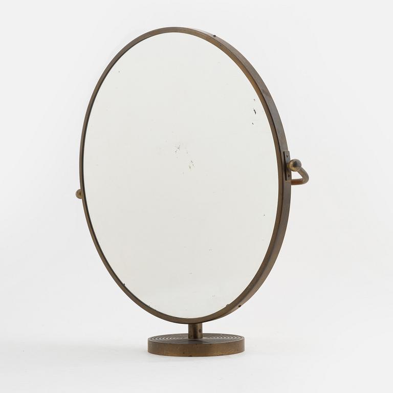 Josef Frank, a brass model '2214' table mirror, Firma Svenskt Tenn, Sweden.