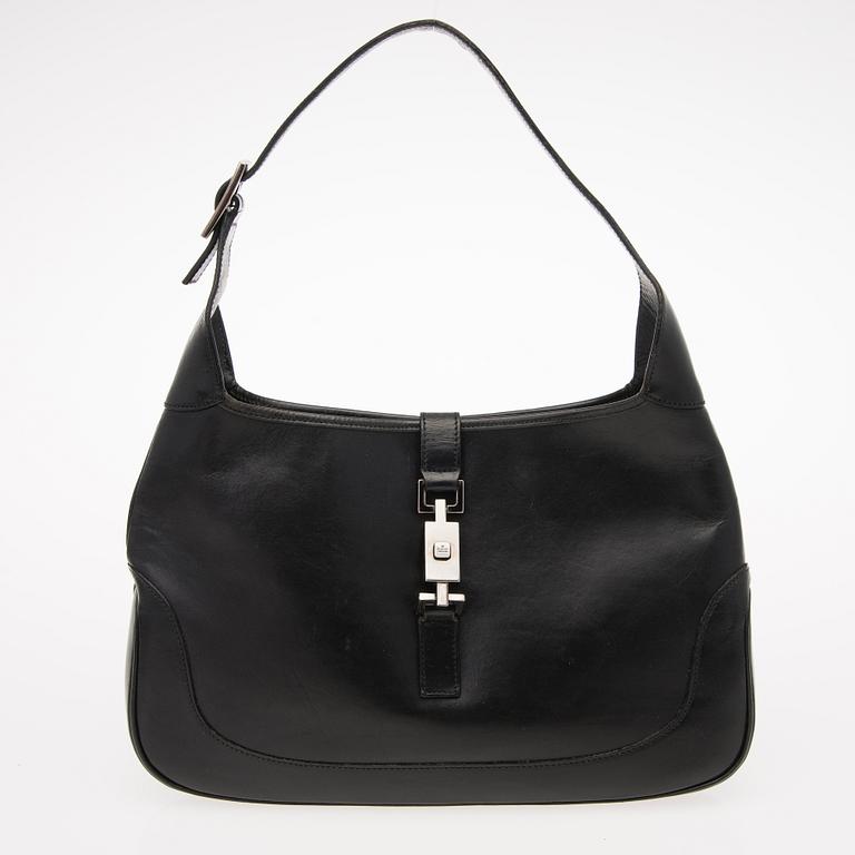 A Black Leather Jackie Bag.