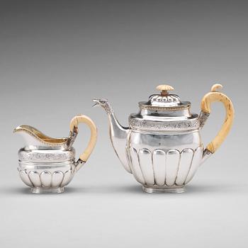 A Russian 19th century parcel-gilt silver coffeepot and cream jug, mark of Gustav Lindgren, St Petersburg 1827.