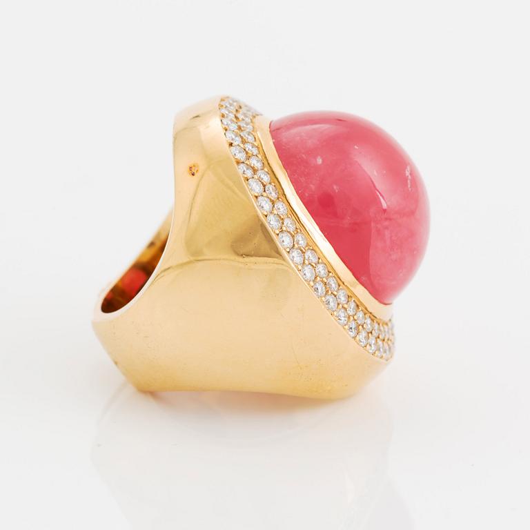 An 18K gold and rhodochrosite Acchinelli ring set with round brilliant-cut diamonds.