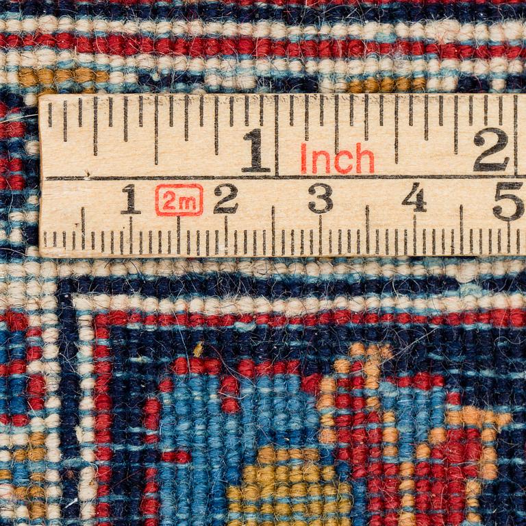 A CARPET, a semi-antique Kashan, ca 314 x 214 cm.