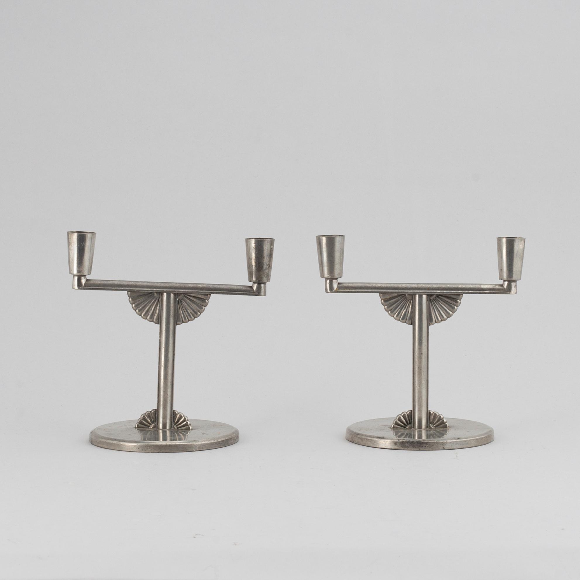 A pair of 1935 pewter candelabras by K E & Co.