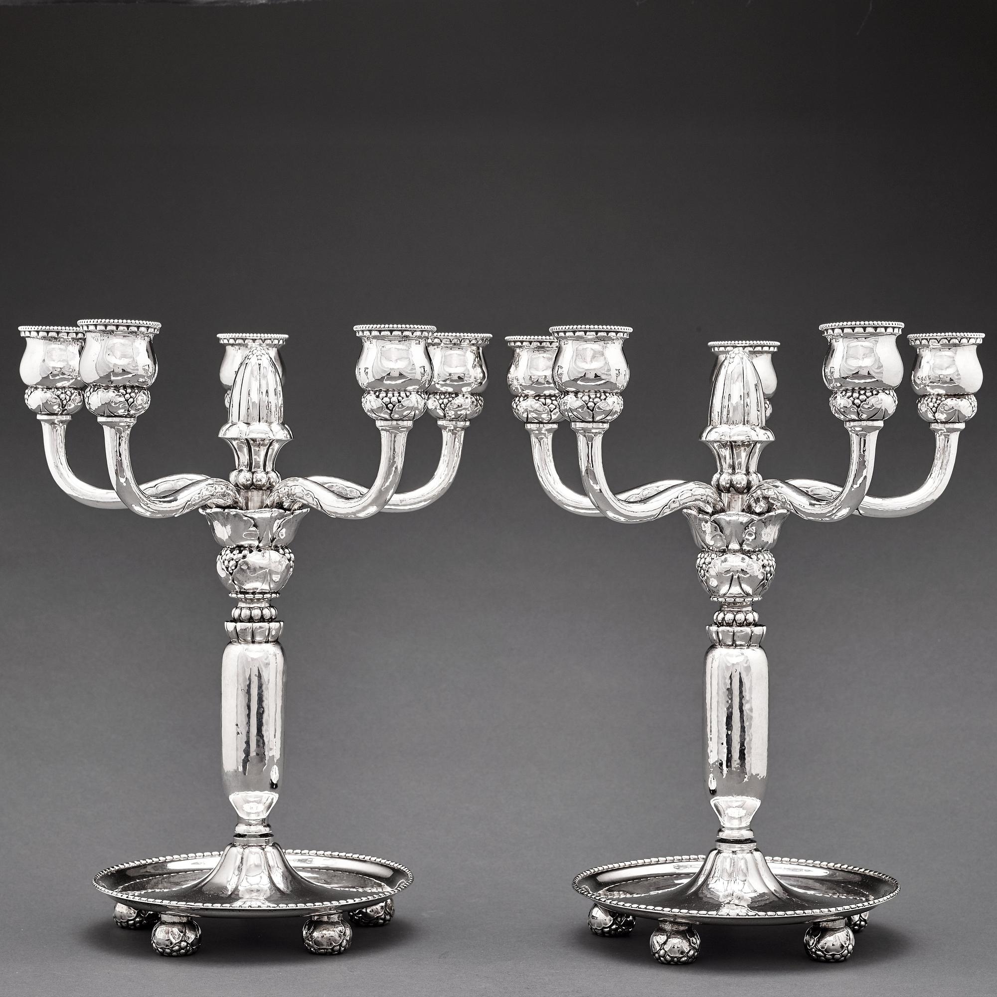 Georg Jensen, a pair of 830/1000 silver five light candelabra, Copenhagen 1920, design nr 200.