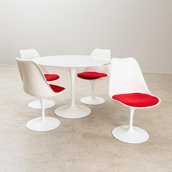 EERO SAARINEN, A TABLE AND FOUR CHAIRS. Tulip. Designed in 1955 for Knoll International, USA.