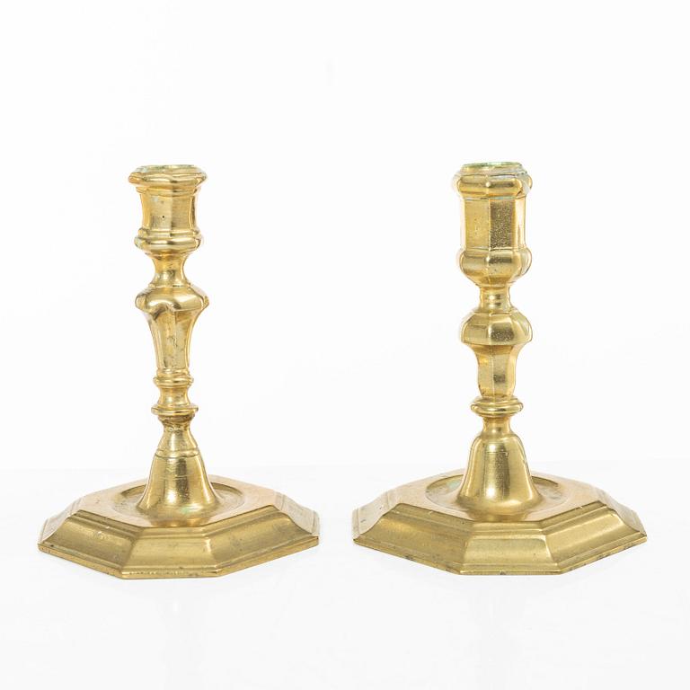 A set of two Northern European late baroque brass candlesticks, first part 18th century.