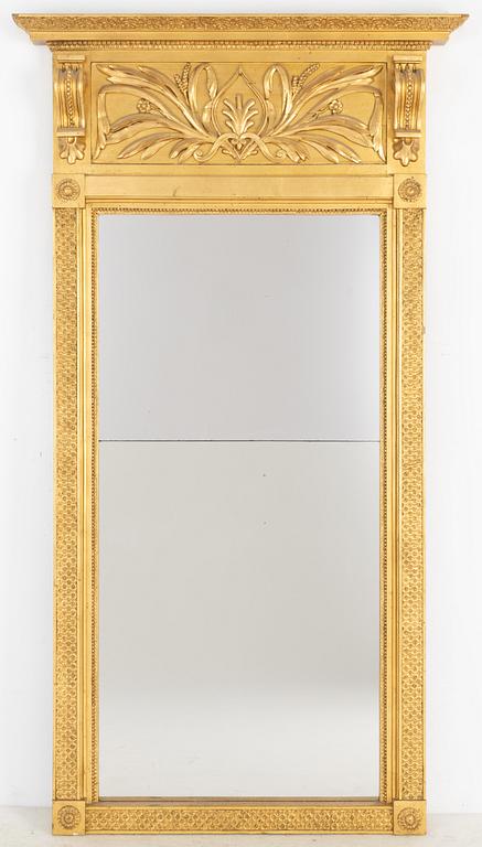 An Empire mirror, first half of the 19th century.