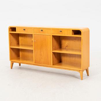 Am elm bookshelf from the first half of the 20th century.