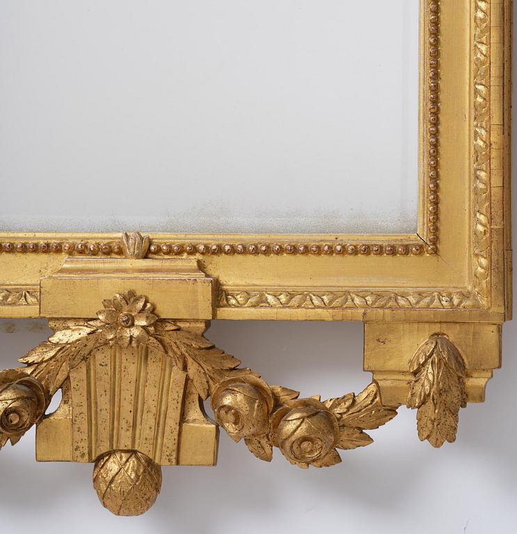 A Gustavian giltwood mirror by C. G. Fyrwald (master in Stockholm 1776-1825).