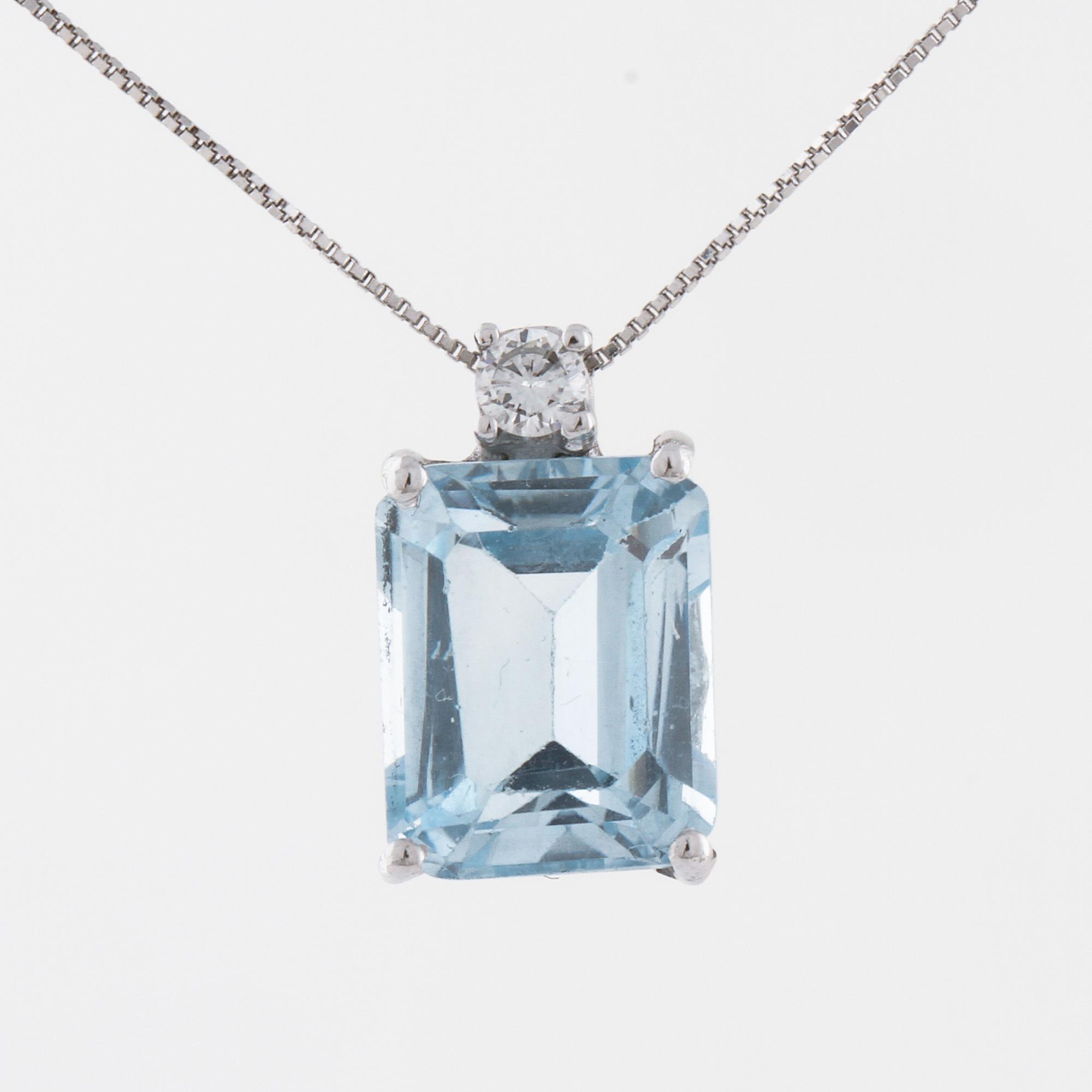 A aquamarine and briliant cut diamond pendant.