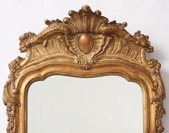 A Swedish rococo giltwood mirror, Stockholm later part 18th century.