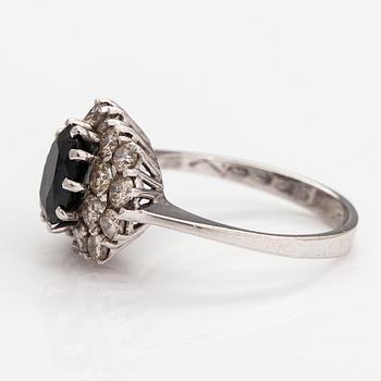 A 14K white gold ring with a sapphire ca. 1.24 ct and diamonds ca 1.25 ct in total. Finnsh import marks 1994.