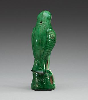 A green glazed figure of a falcon, Qing dynasty.