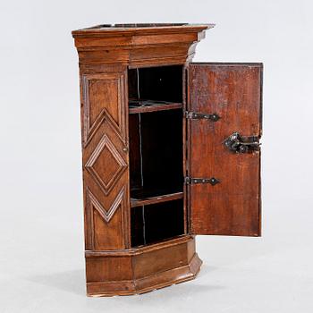 A 18th century corner cabinet.