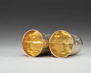 A pair of Russian 19th century silver-gilt beakers, makers mark of Vasily Icanov, Moscow 1893.