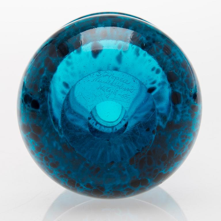 a turquoise glass vase.