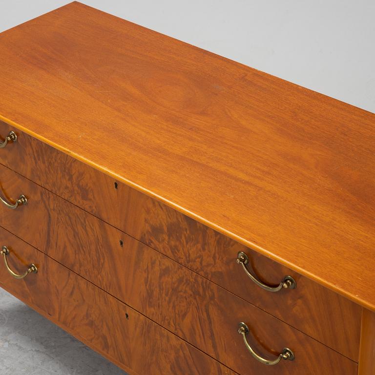 A Swedish Modern mahogany chest of drawers, 1940's/50's.