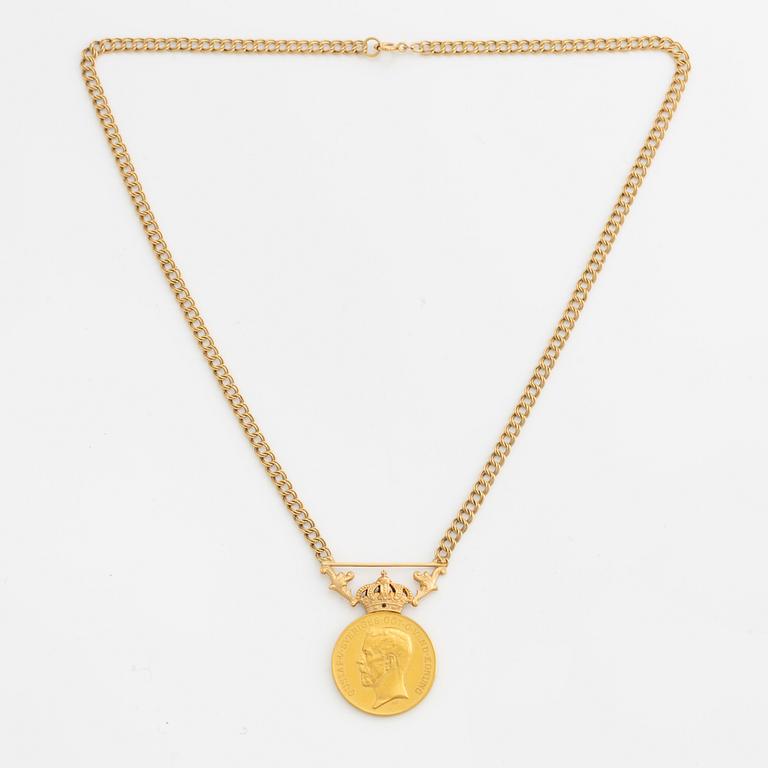 Medal, for diligence and integrity, gold, with a later chain in 18K gold.