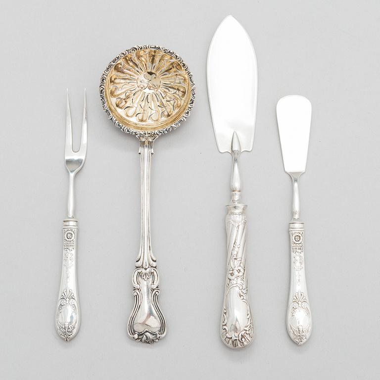 Four pieces of Russian silver cutlery.