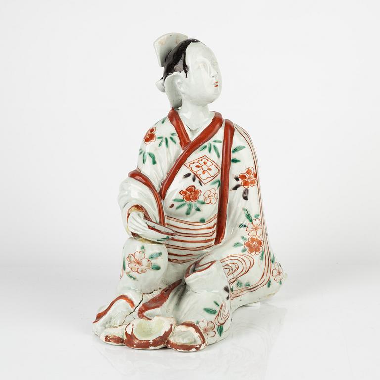 A Japanese porcelain figure, 18th century.