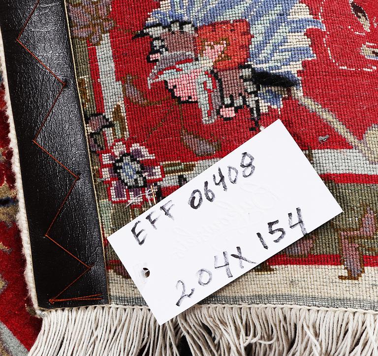 A Tabriz rug, part silk, 50 raj, c. 204 x 154 cm.