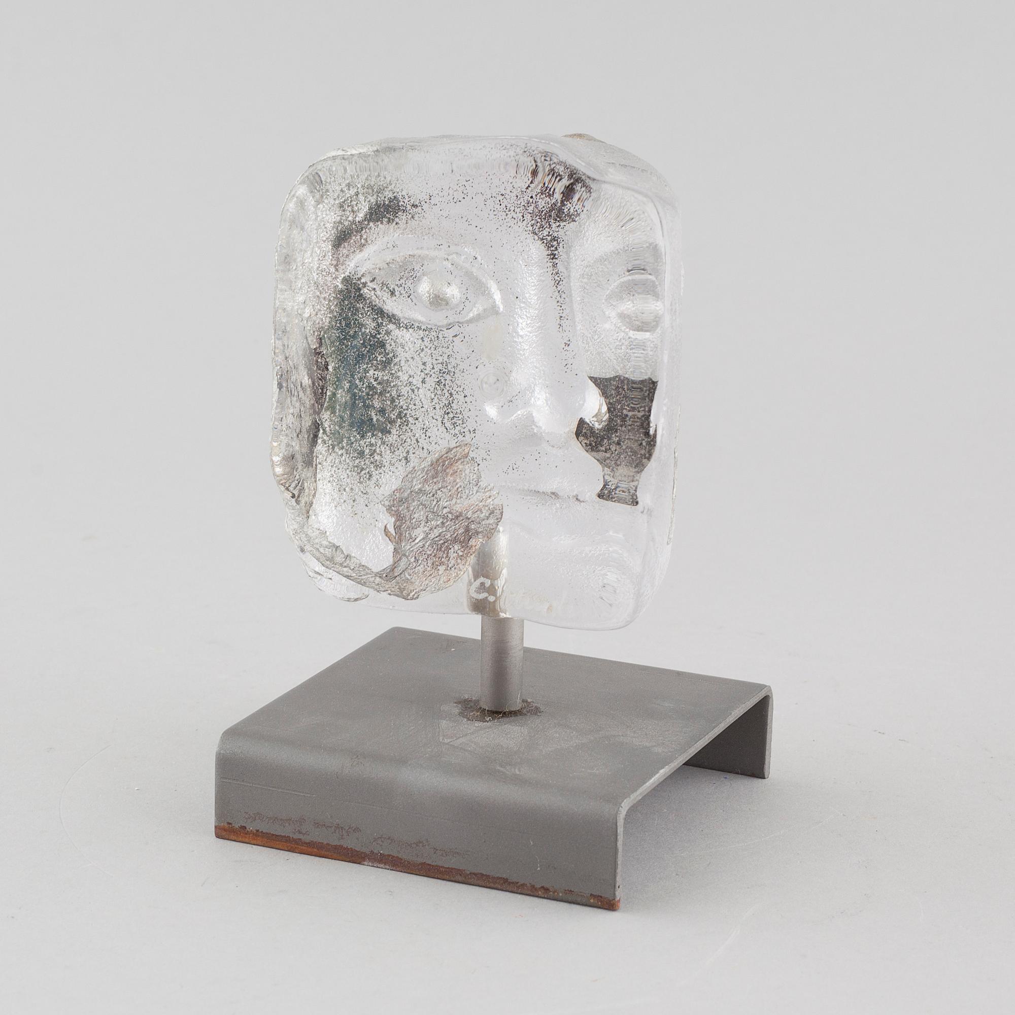 a glass object, signed.