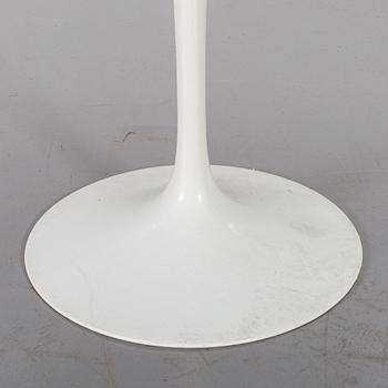 AN EERO SAARINEN "TULIP" TABLE BY KNOLL INTERNATIONAL.