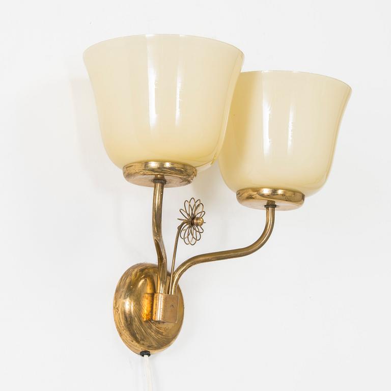 A mid-20th century wall light for Korumo.