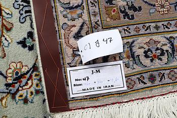 A carpet, Kashan, signed Fani, ca 420 x 300 cm.