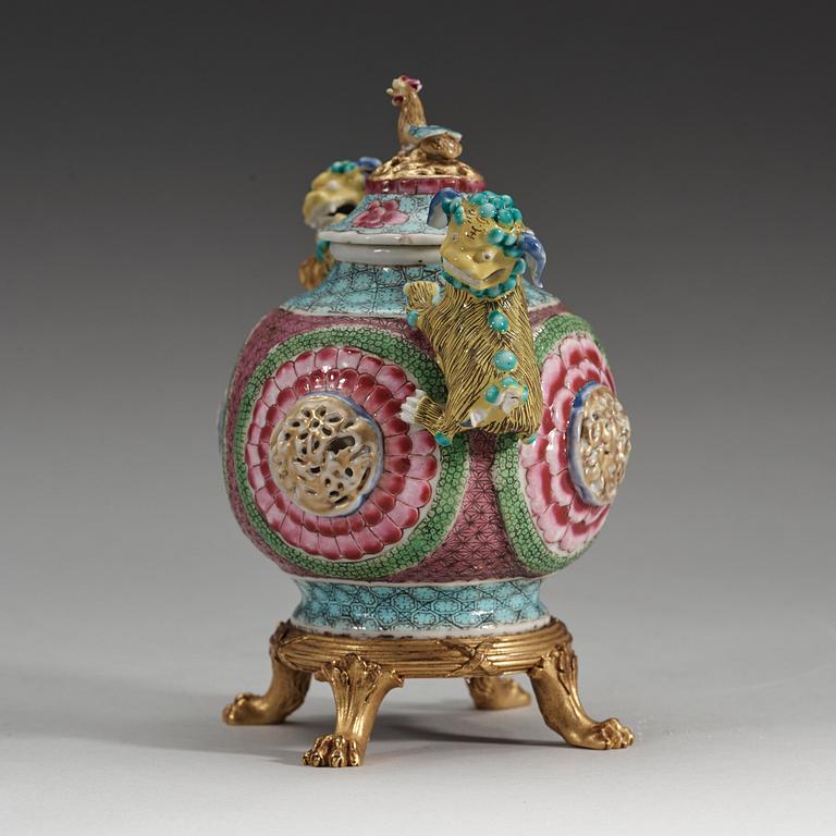 A gilt bronze mounted famille rose tea pot with cover, Qing dynasty, Yongzheng (1723-35).