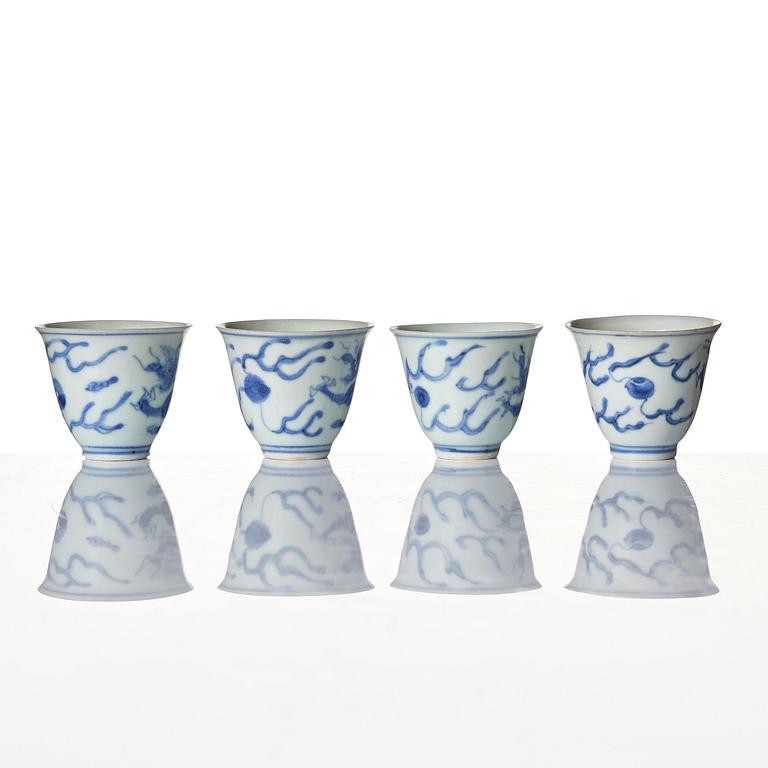 A set of four blue and white dragon wine cups, 'Hatcher Cargo', 17th century.