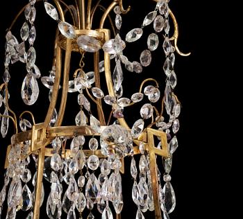 A German Louis XVI ormolu and cut-glass nine-light chandelier attributed to Johann Christoph Ermisch, late 18th century.