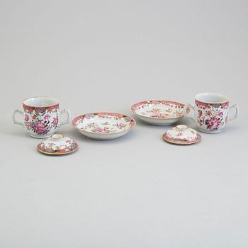 A pair of famille rose cups with covers and stands, Qing dynasty, Qianlong (1736-95).