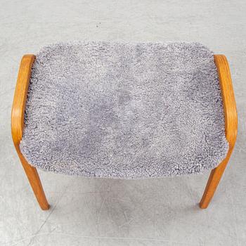 Yngve Ekström, a 'Lamino'  shearling upholstered lounge chair and foot stool from Swedese.