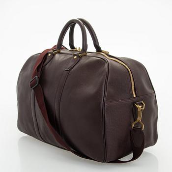 Louis Vuitton, a 'Taiga Kendall PM' weekend bag.