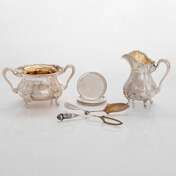 Sugar bowl, cream jug, pastry tong, and 6 coasters, silver, Auran Kultaseppä, Turku 1964-81.