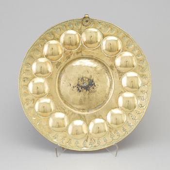 A probably 17th century brass wall plaque.